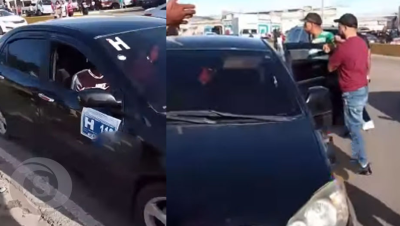 Un chofer de carro de concho y un pasajero